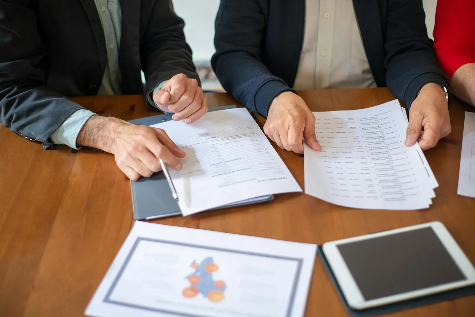 Team reviewing operational documents in a business meeting