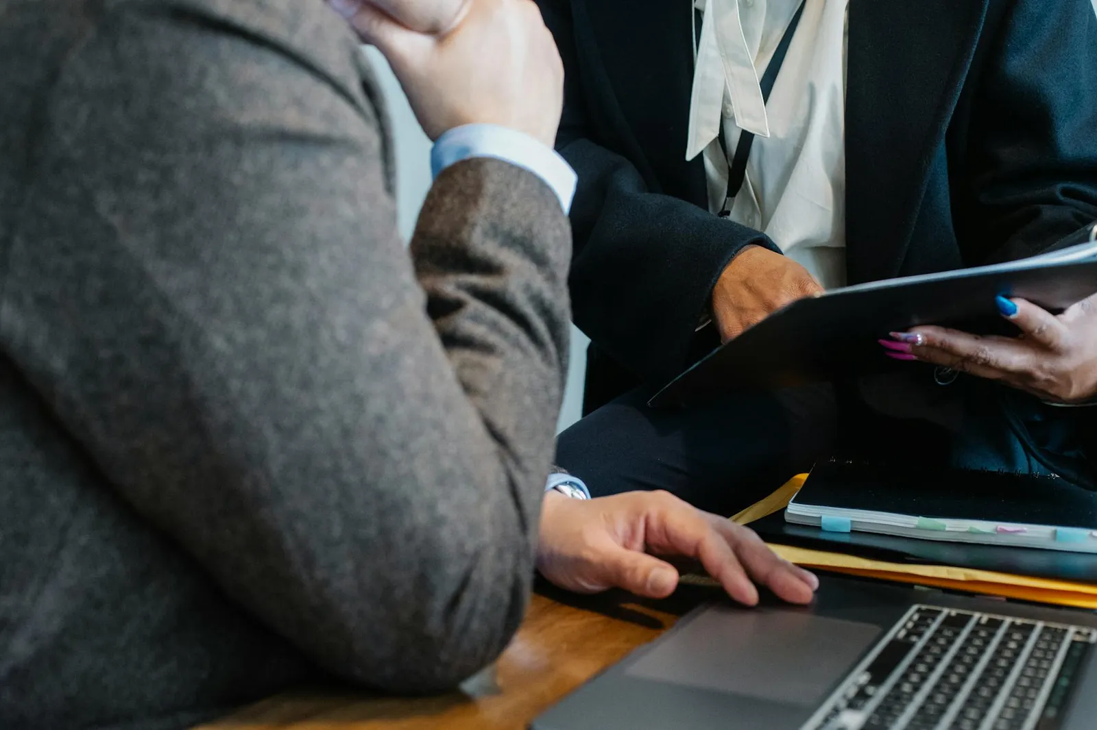Two professionals discussing practical AI consulting for a small business